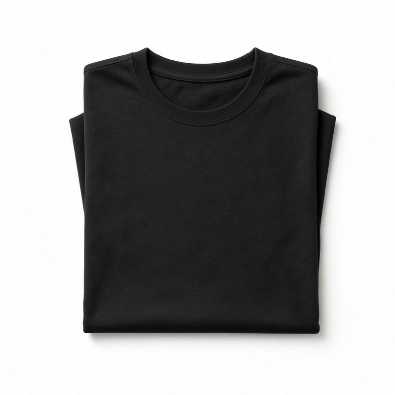 Folded black cotton crew-neck t-shirt on a white background